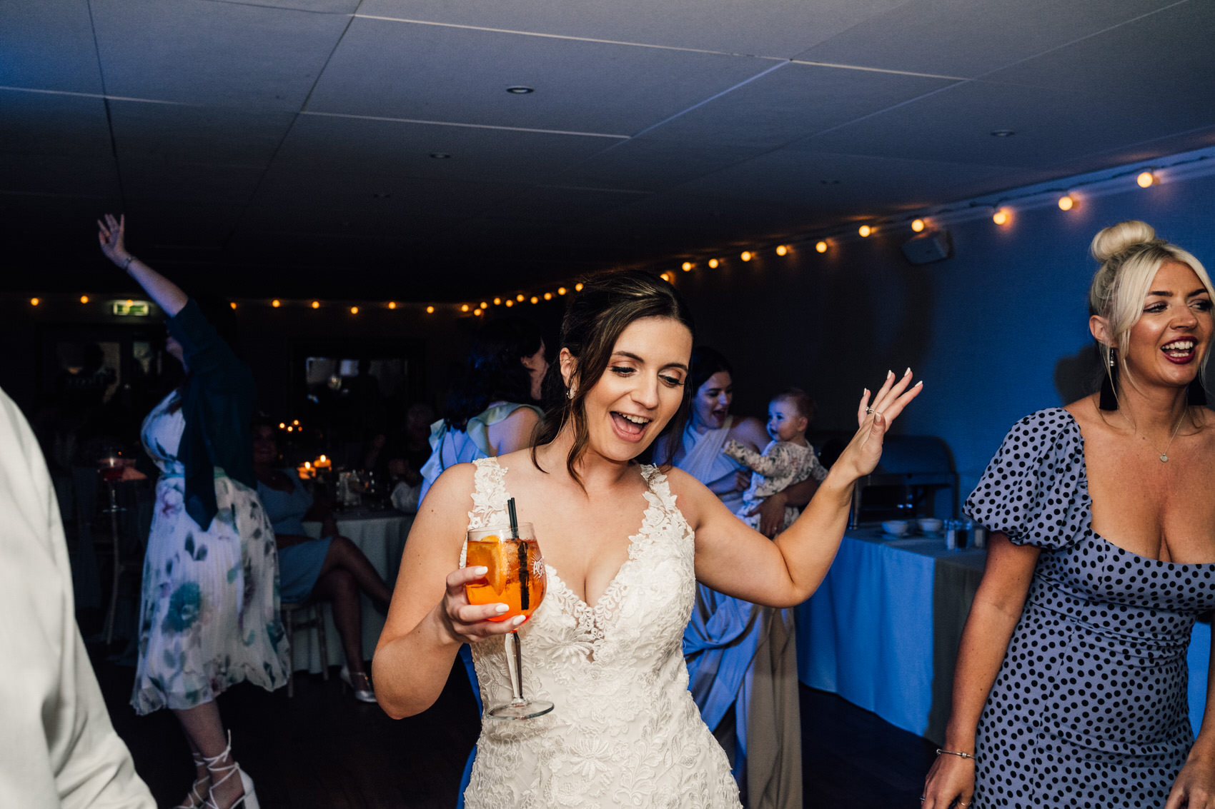 bride dancing with a drink