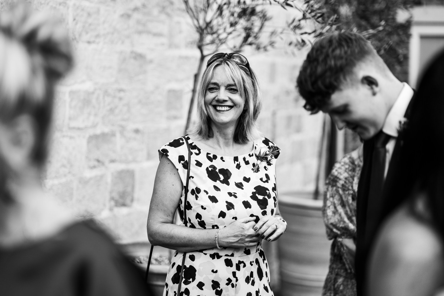 black and white image of guest laughing
