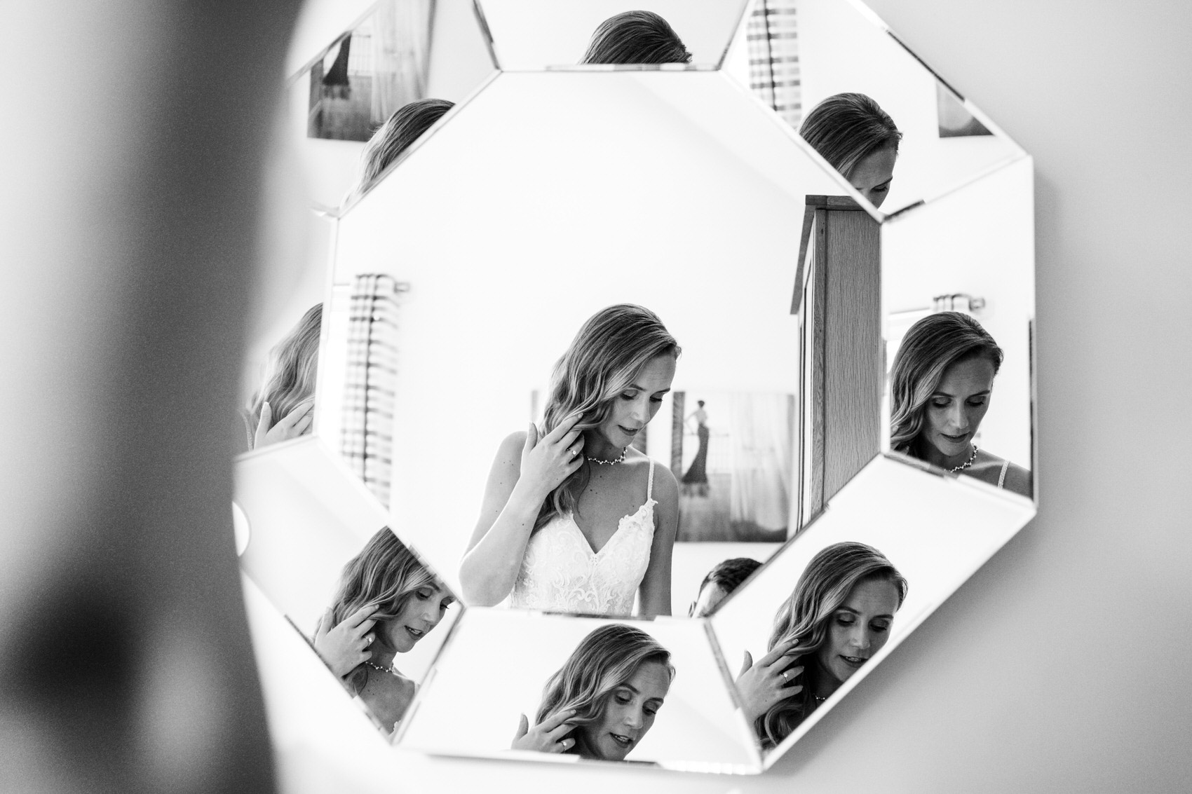 Multiple images of bride in the mirror