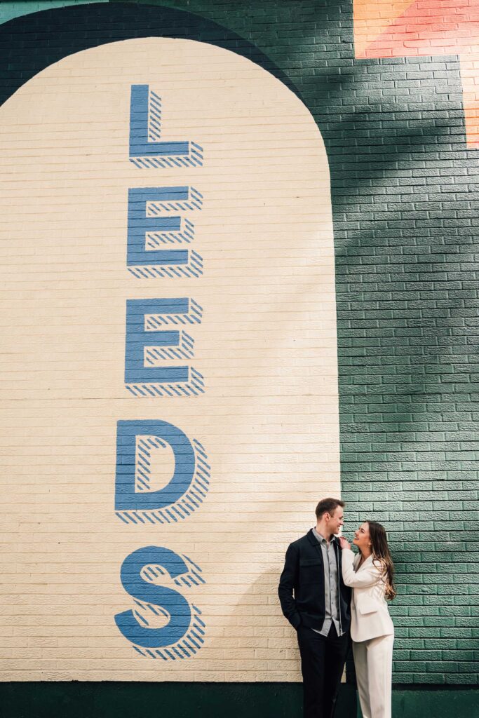 Couple infront of leeds mural. leeds wedding photographer